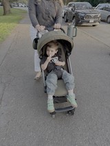 Mother and Child Strolling Through Suburban Neighborhood