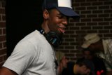 Entertainer in Grey T-Shirt and Brim Cap