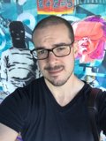 Artful Portrait of Dave B in Front of Graffiti Wall