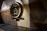 Cryptic Symbol on Bronze Handrail