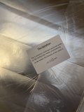Business Card Attached to Metal Surface