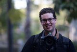 Photographer Dave B smiles while taking photos