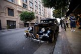 Vintage Coupe on the City Sidewalk