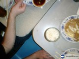 A Man Enjoying A Delicious Plate Of Food At The Dining Table