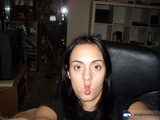 Portrait of a Woman with Black Hair in a Cozy Living Room