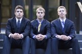 Three Men in Suits Take a Seat