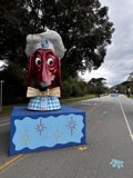 The Majestic Dog Statue on the Tarmac Road