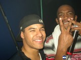 Two Men with Microphone and Baseball Caps