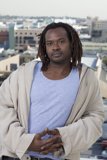 Dreadlocked James in Front of Building