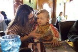 Mother and Child Sharing a Moment at Restaurant