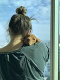 Woman and Her Furry Friend Enjoying a Cloudy Day
