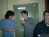 Three Young Men Posing in Front of a Door
