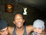 Three Men Strike a Pose in Front of the Television