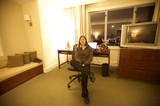 Woman Relaxing in San Francisco Hotel Room at Night