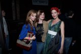Three Ladies Strike a Pose at a Party