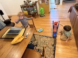 Two Young Children Playing with Toys at Home