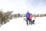 Couple Poses at Snowy Lake Tahoe Summit