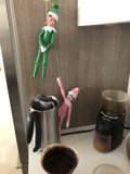Elf Dolls Perched on a Coffee Maker