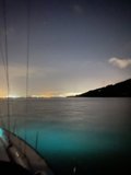 Night Sailing Beneath a City Skyline