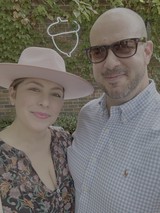 Couple's Casual Portrait Against Ivy-Covered Brick Wall