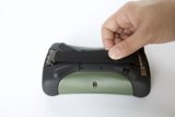 Hand Held Device on White Surface