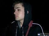 Hooded Man Contemplating