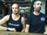 Two Friends Enjoying a Beer at a Wood Table