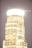 The Majestic Clock Tower of the Urban High Rise Building