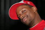 Red Shirted Man in a Baseball Cap