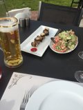 Beer and Food at an Outdoor Table
