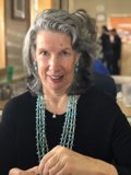 Beautiful Gray Haired Lady with a Ornamental Necklace