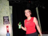 Woman with Beer Bottle at a Show