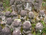 Stone statues in the grass at Kyoto City Hall