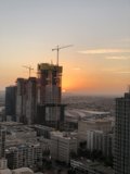Urban Sunset with Construction Cranes