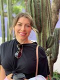 Smiling Woman with Cup and Cacti