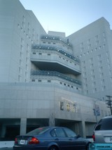 Parked Car in Front of an Office Building