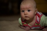 Curious Baby During Tummy Time on Carpet