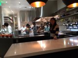 Group gathering for a meal at a bustling restaurant