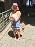 A Woman and Her Companions on the Sidewalk