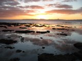 Ocean Sunset with Rocks and Water