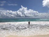 Surfer in the Cumulus Clouds