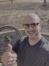 Cyclist Taking Thumbs Up Selfie Outdoors