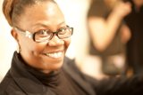 The Happy Woman with Glasses