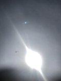 Sun Flare Above High-Flying Plane