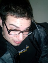 Portrait of a Man in Jacket and Glasses