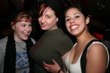 Three Women Celebrate at Nightclub
