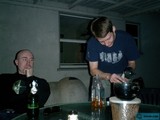 Two Men Enjoying a Beer at the Table