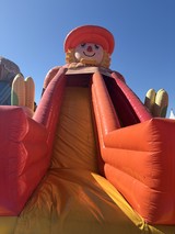 Giant Inflatable Farmer Character with Corn at Festival