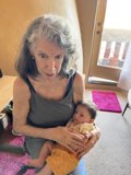 A Portrait of Love: Rhoda B Holding a Baby