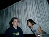 Couple Poses in Front of Curtain